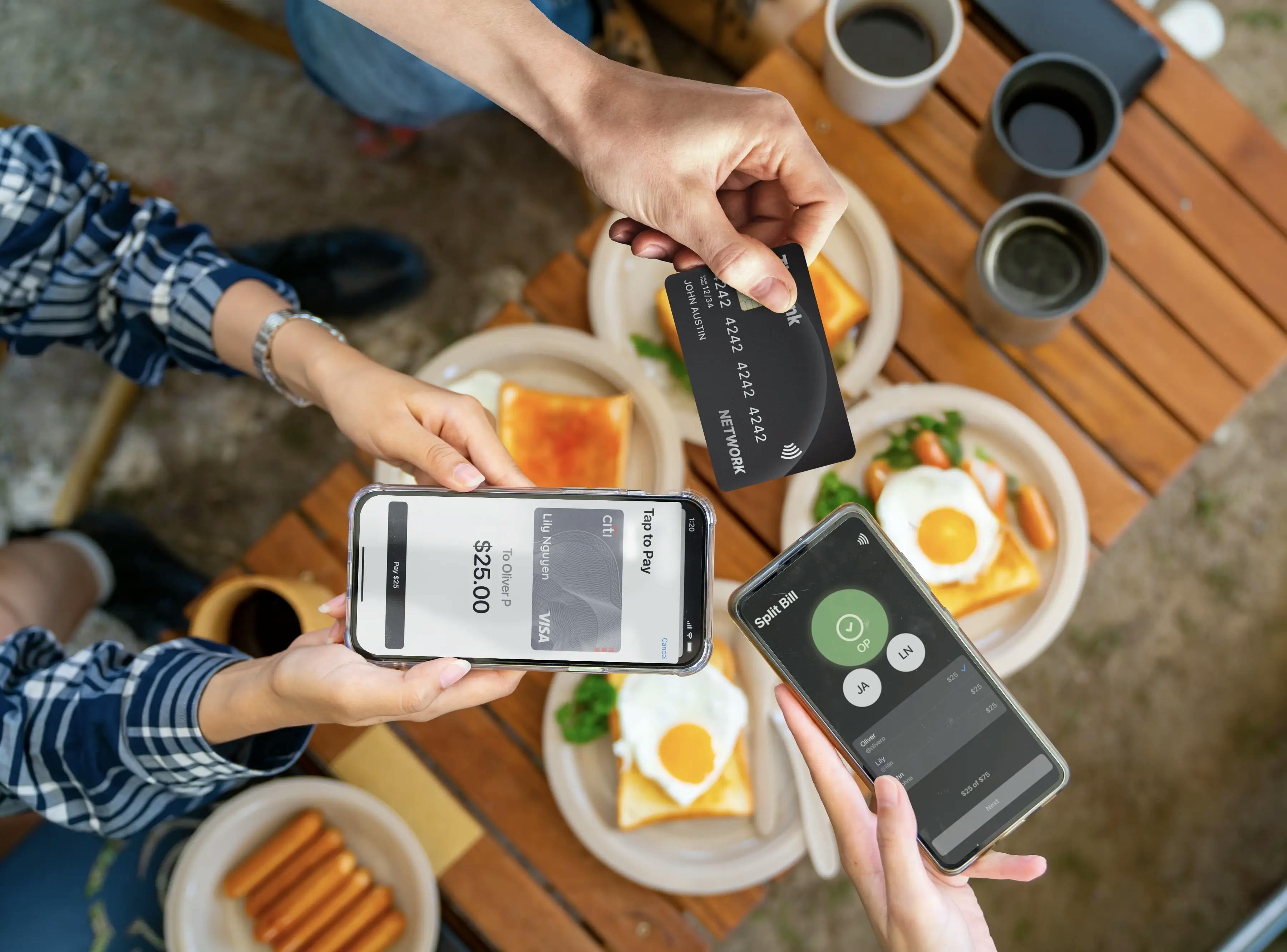 Three people splitting the bill at a restaurant, using card and phone, to the Card+ App