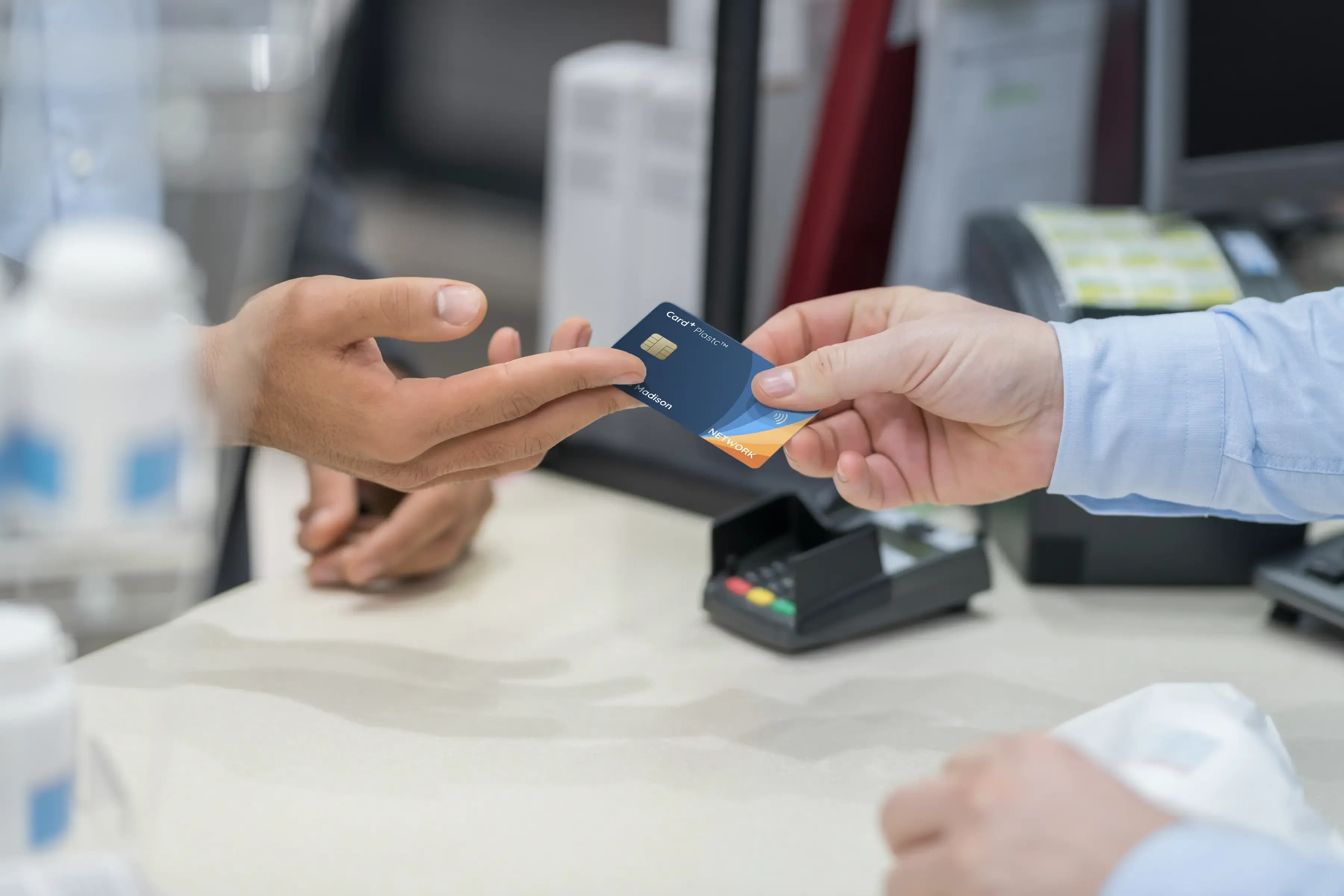 Person handing over a Card+ Plastc to an unknown person, confident in the knowledge : there's no easily stolen fixed numbers, imprinted thereon