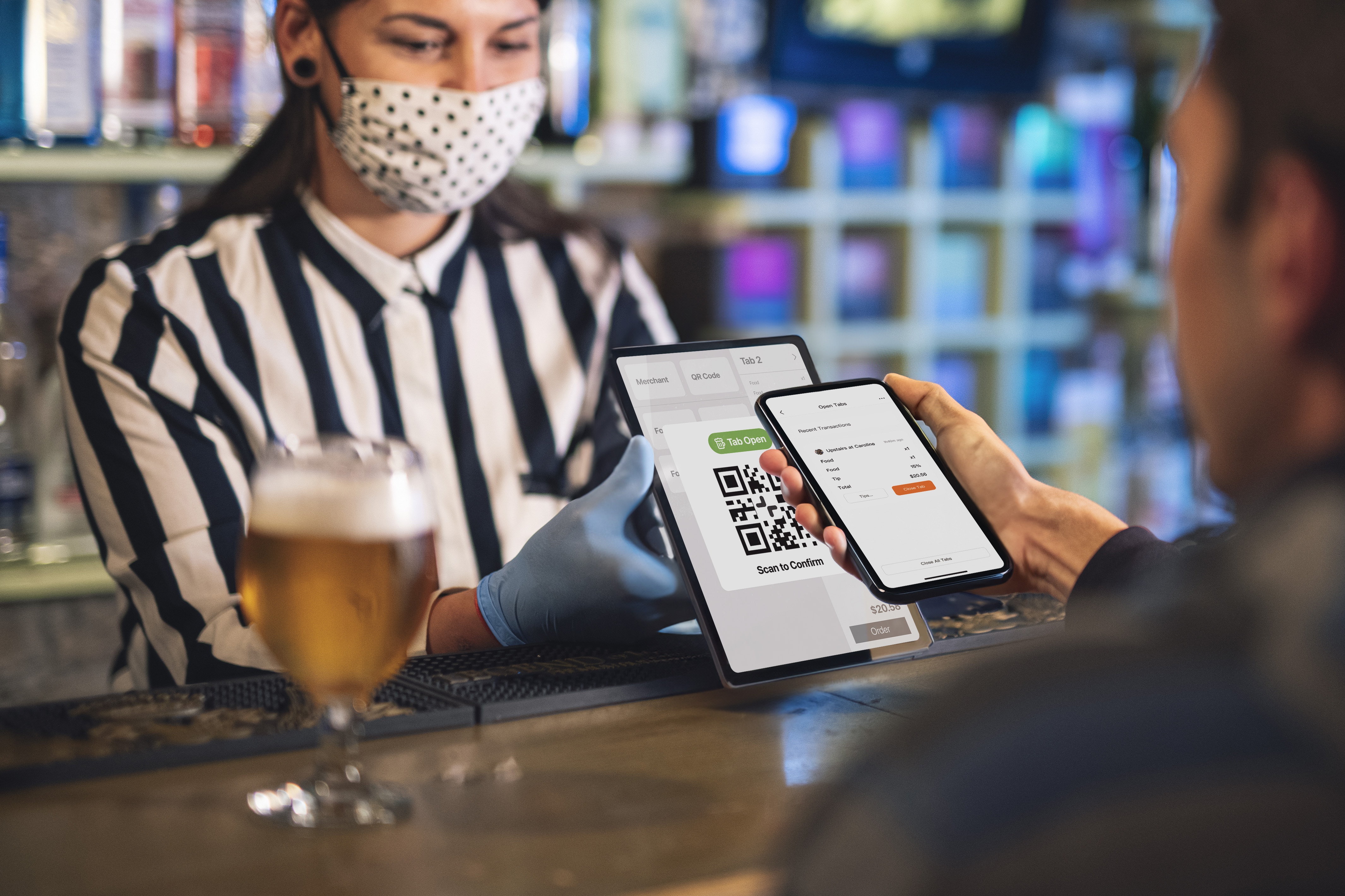 user scans QR code at bar to keep tab open via merchant's PoS